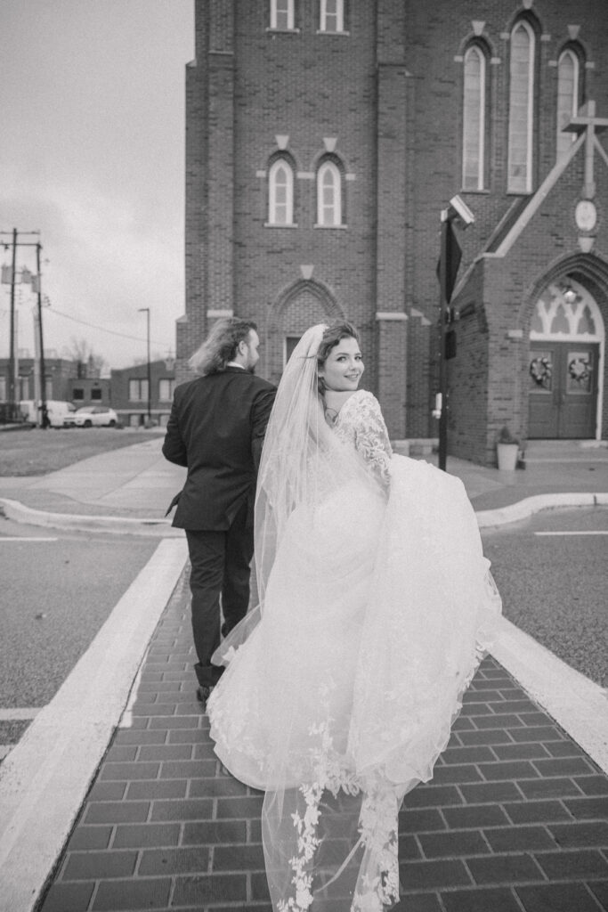 Couple walking by there wedding venue at Main Street Abbey.