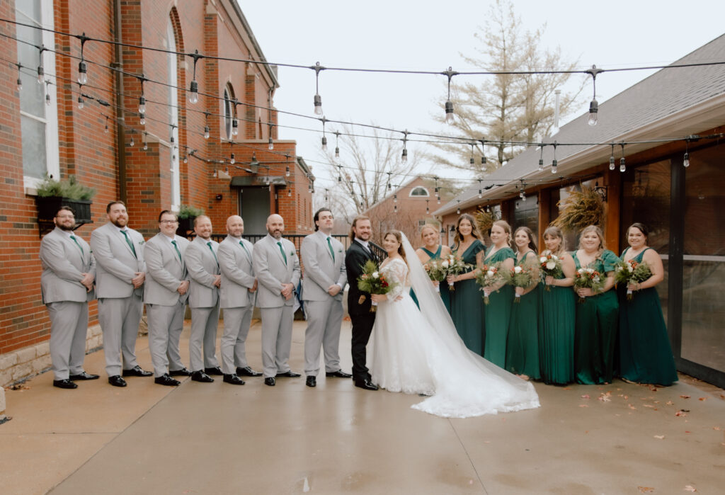 Wedding party with the couple standing together.