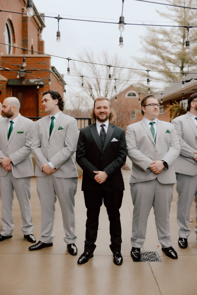 Groomsmen pictures outside of Main Street Abbey