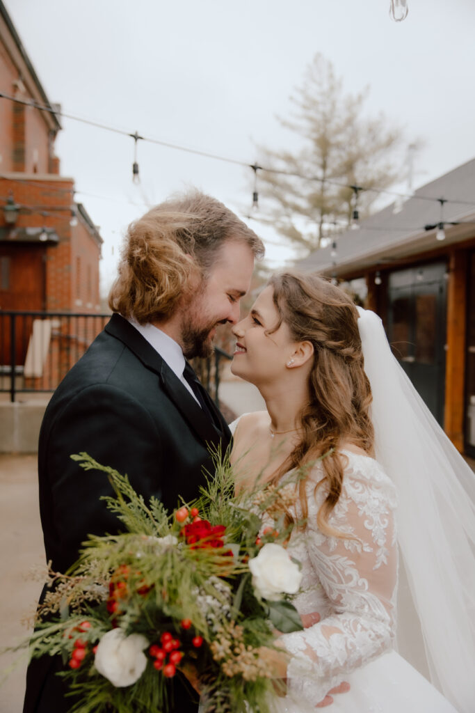 The couple standing at patio located at Main Street Abbey.