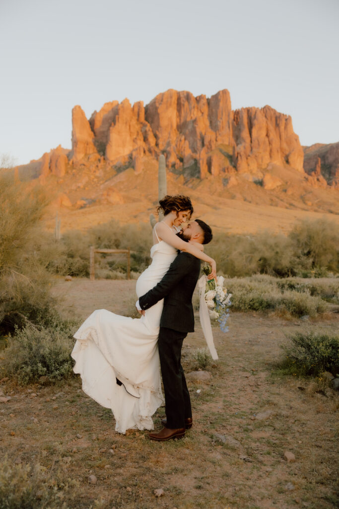 couple holding one another in the air