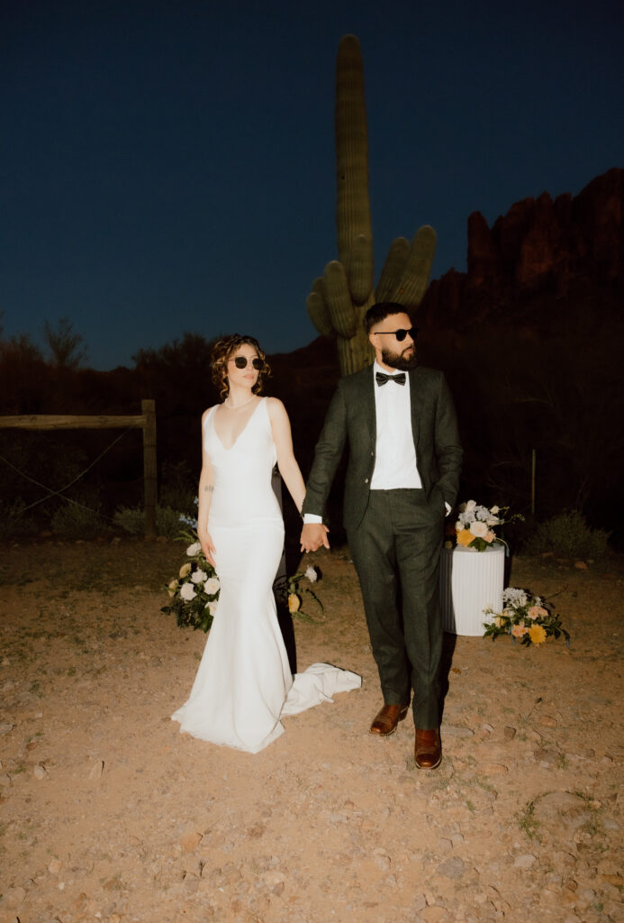 couple holding hand with sunglasses