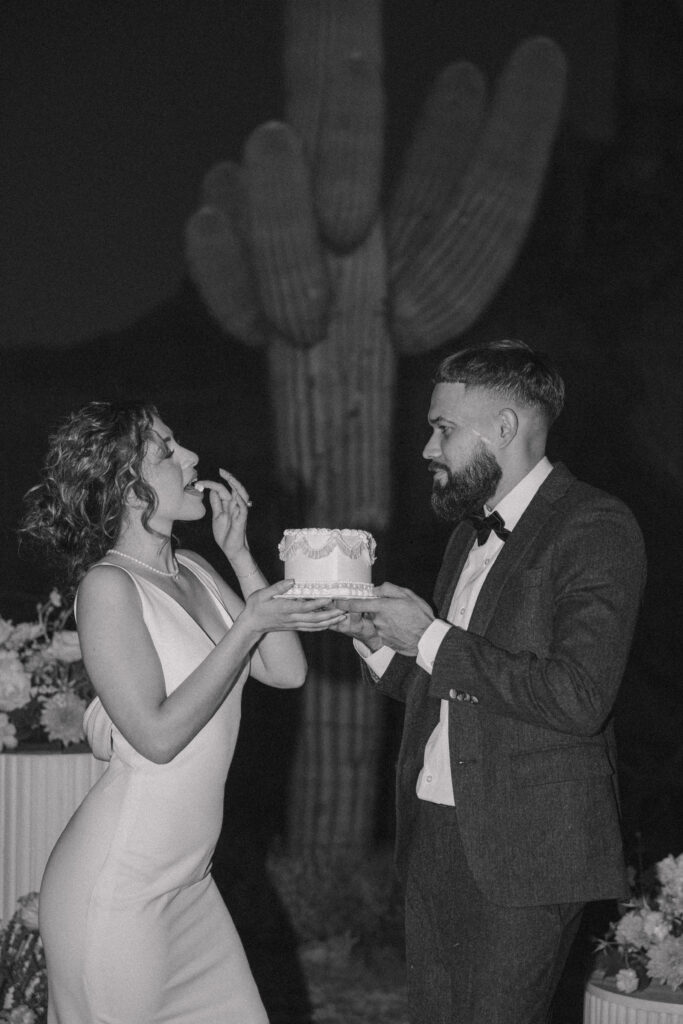 couple eating cake for there elopement 