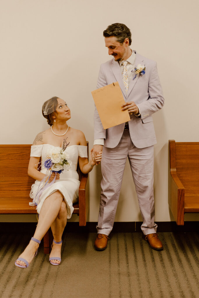 couple holding hand at a courthouse 
