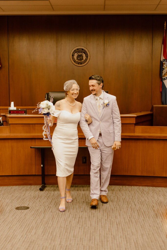 couple laughing in the courthouse of st louis 